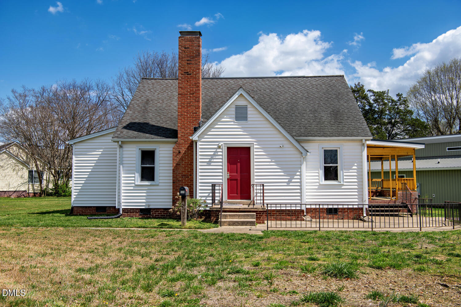 414 South Maple Street Graham, NC 27253 - Photo 30 of 42 a front view of a house with a yard