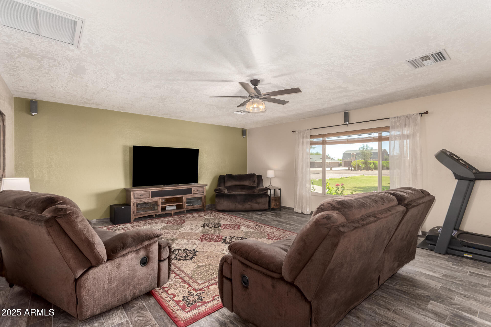 12548 East Cloud Road Chandler, AZ 85249 - Photo 11 of 34 a living room with furniture and a flat screen tv