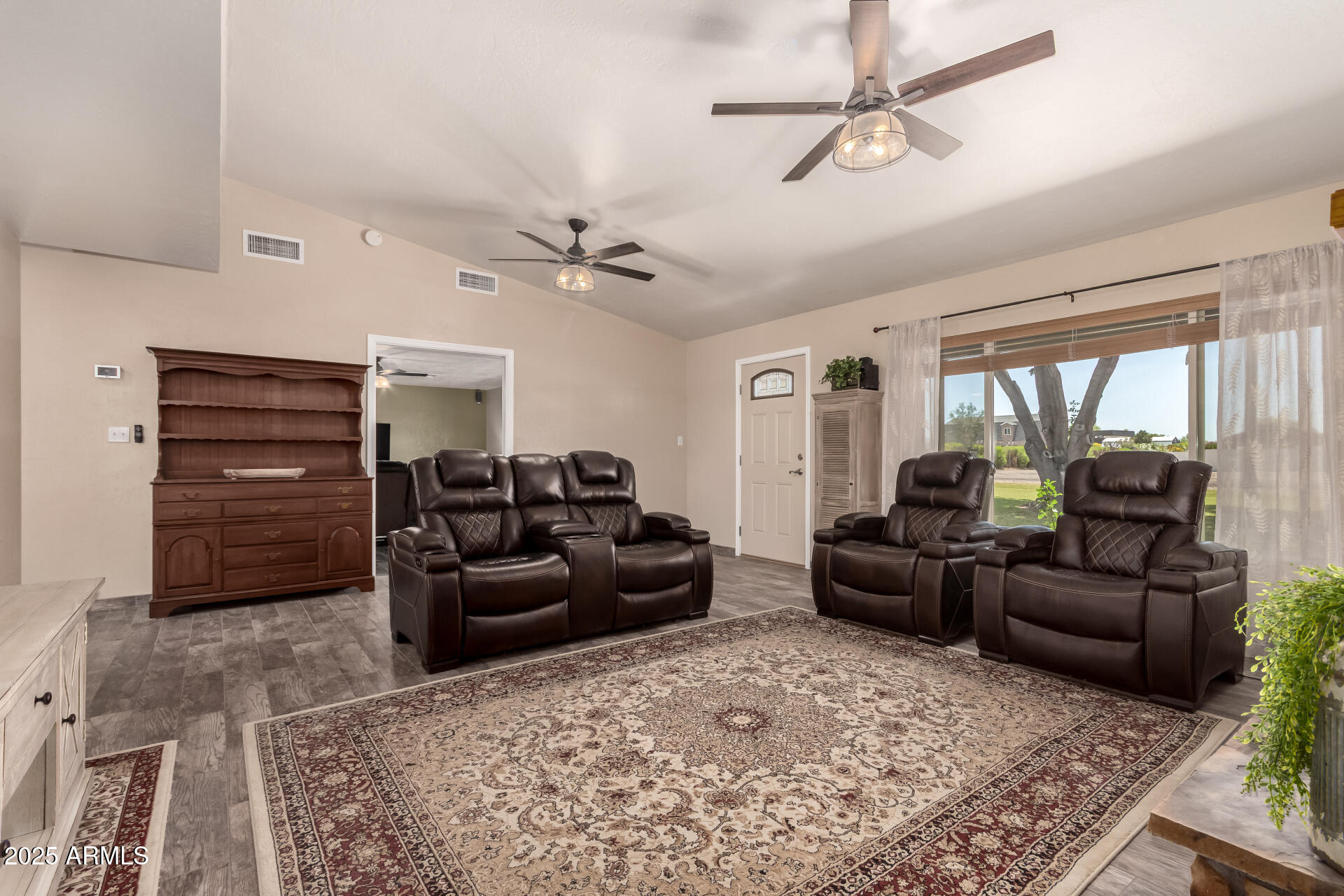 12548 East Cloud Road Chandler, AZ 85249 - Photo 12 of 34 a living room with furniture and a chandelier