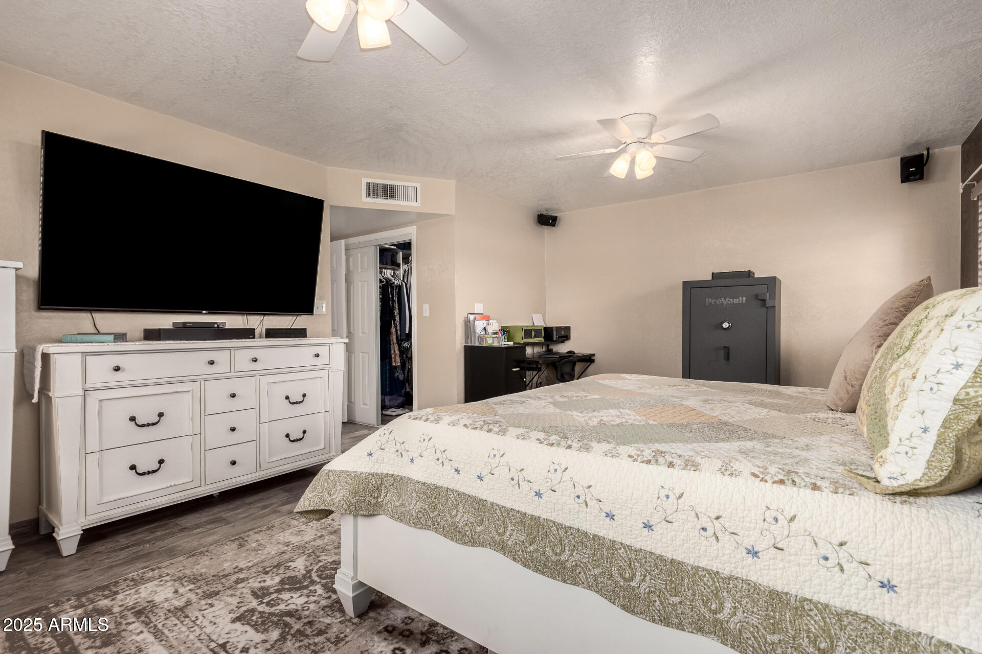 12548 East Cloud Road Chandler, AZ 85249 - Photo 16 of 34 a bedroom with a bed and a flat screen tv