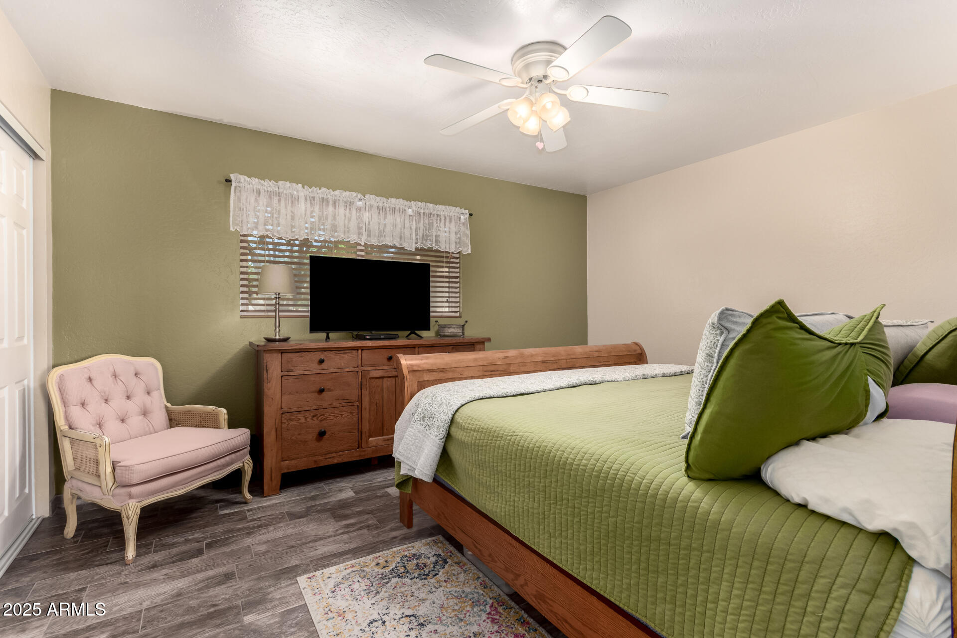 12548 East Cloud Road Chandler, AZ 85249 - Photo 18 of 34 a bedroom with a bed and a flat screen tv