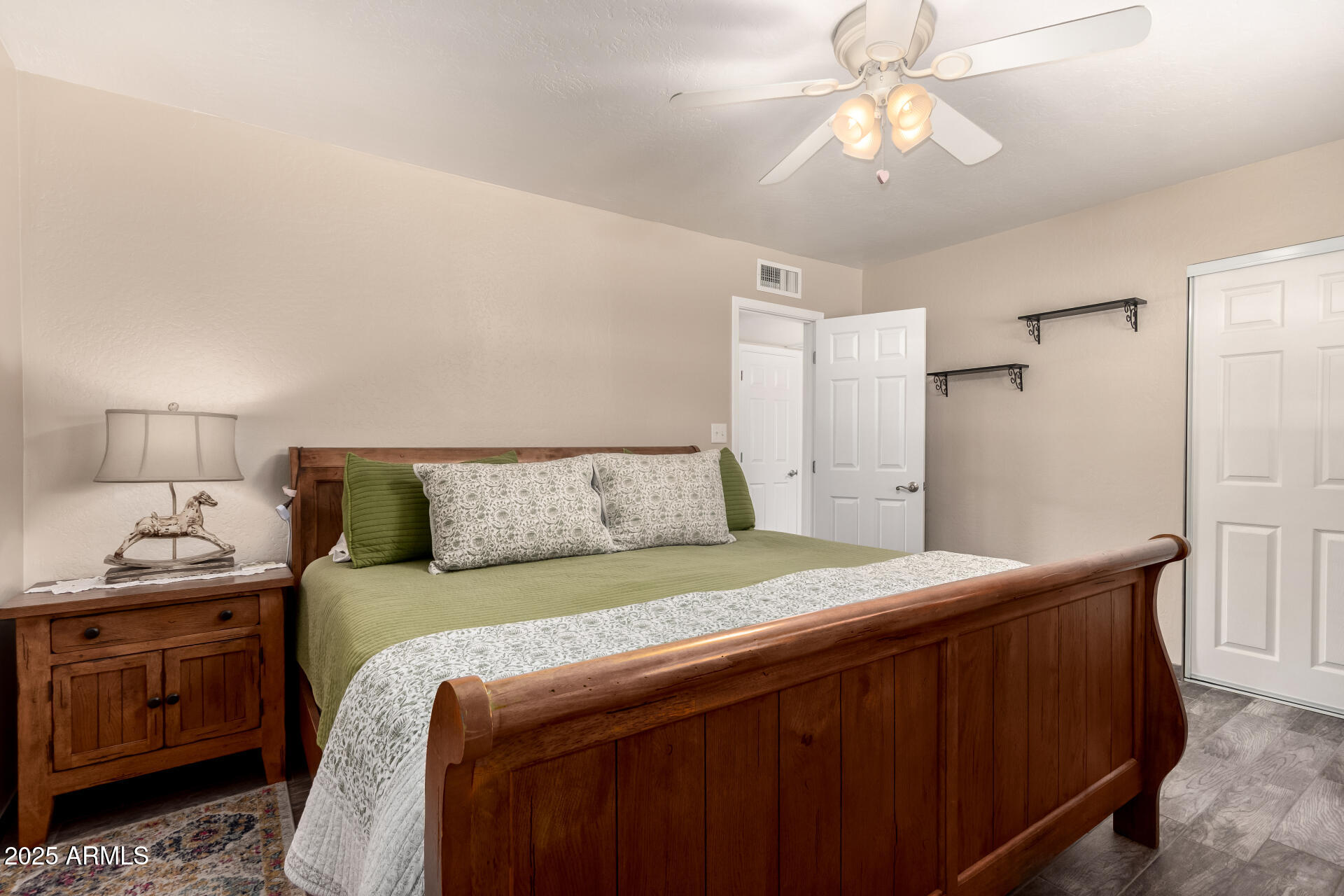 12548 East Cloud Road Chandler, AZ 85249 - Photo 19 of 34 a bedroom with a bed and a chandelier