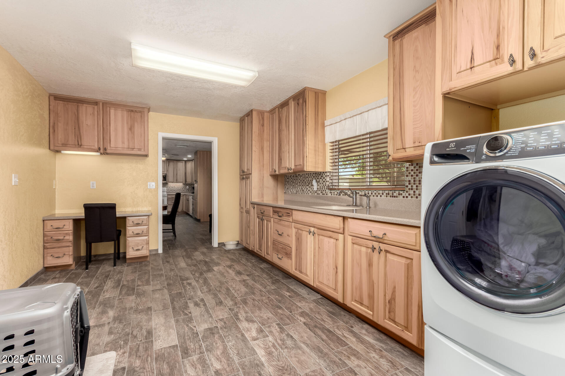 12548 East Cloud Road Chandler, AZ 85249 - Photo 24 of 34 a kitchen with a stove top oven sink and cabinets