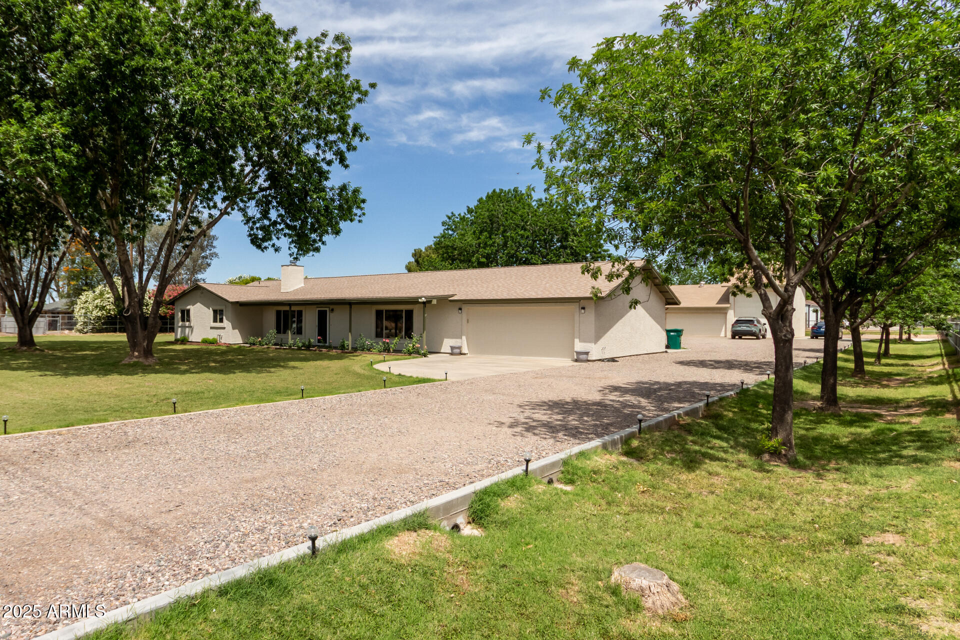 12548 East Cloud Road Chandler, AZ 85249 - Photo 5 of 34 a front view of a house with garden
