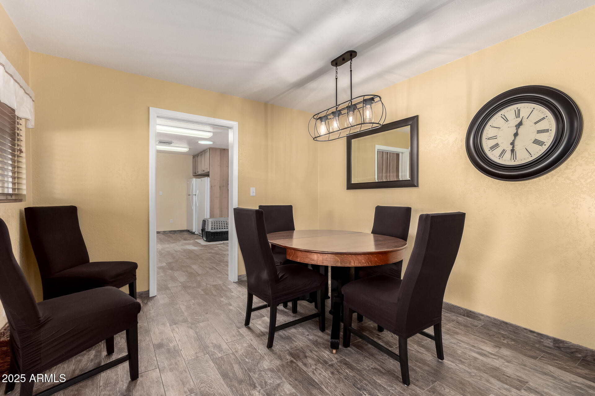 12548 East Cloud Road Chandler, AZ 85249 - Photo 6 of 34 a view of a dining room with furniture and wooden floor