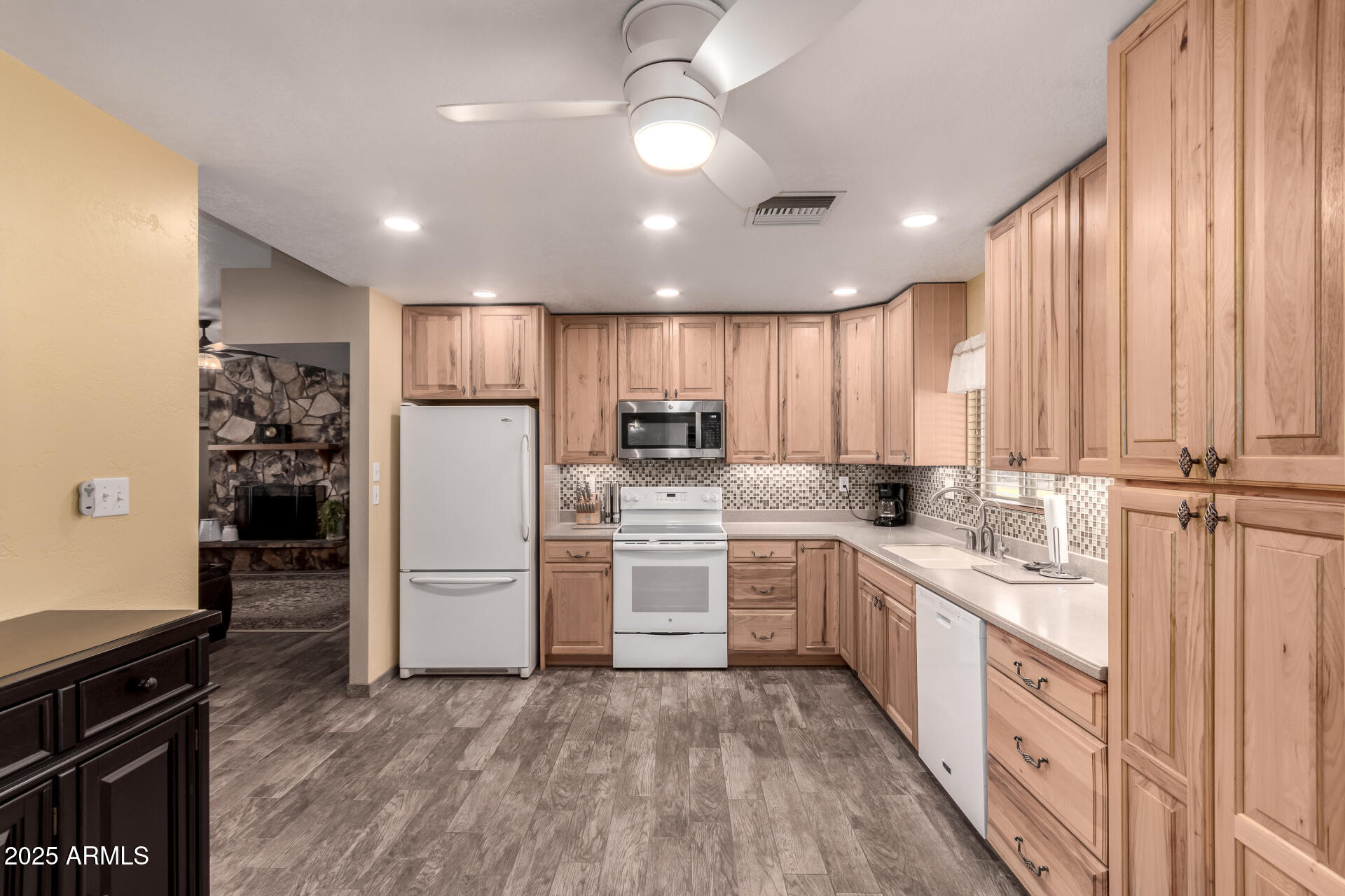 12548 East Cloud Road Chandler, AZ 85249 - Photo 8 of 34 a large kitchen with cabinets and stainless steel appliances
