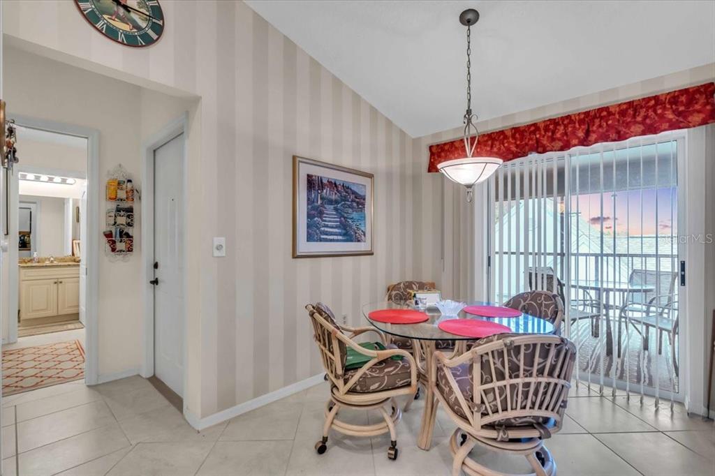 6713 Stone River Road, Unit 206 Bradenton, FL 34203 - Photo 19 of 58 a dining room with furniture and window