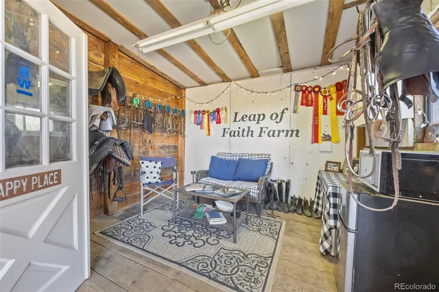 a view of an chairs and table in a room