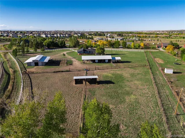 an aerial view of a houses with outdoor space