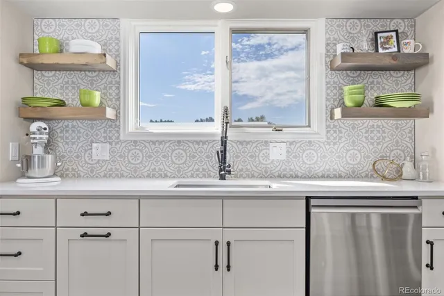 a kitchen with a sink and a window