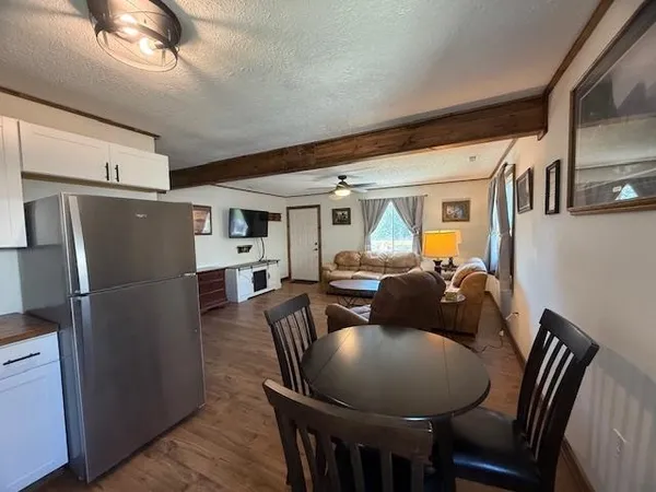 a bathroom with a sink a mirror and shower