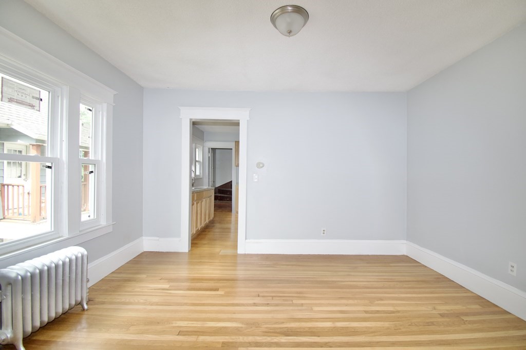 80-82 Silver Street Springfield, MA 01107 - Photo 12 of 31 a view of an empty room with wooden floor