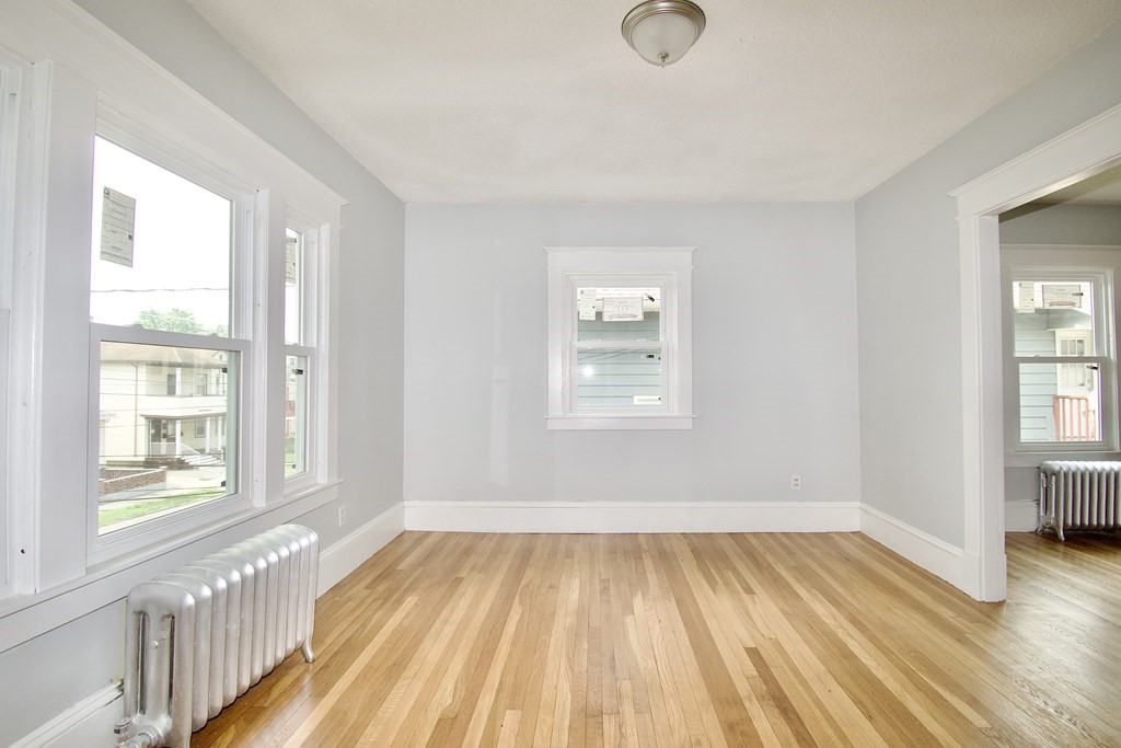 80-82 Silver Street Springfield, MA 01107 - Photo 13 of 31 a view of a room with wooden floor and windows