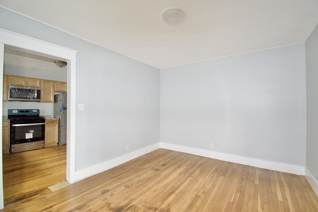 80-82 Silver Street Springfield, MA 01107 - Photo 20 of 31 a view of a room with wooden floor and an empty space