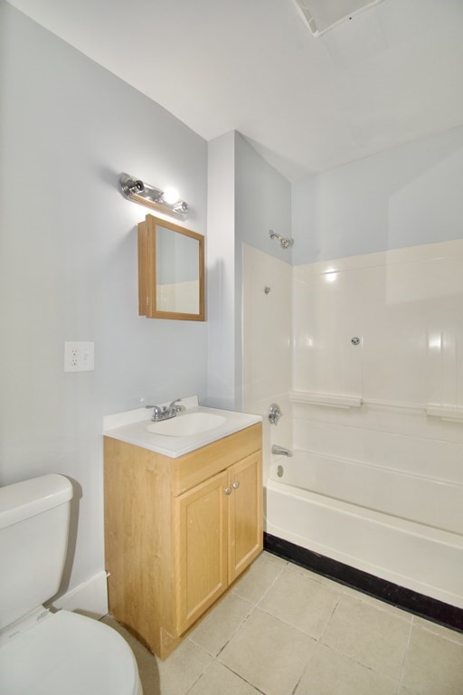 80-82 Silver Street Springfield, MA 01107 - Photo 22 of 31 a bathroom with a toilet sink and mirror