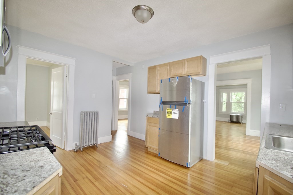 80-82 Silver Street Springfield, MA 01107 - Photo 6 of 31 a view of a kitchen cabinets and wooden floor