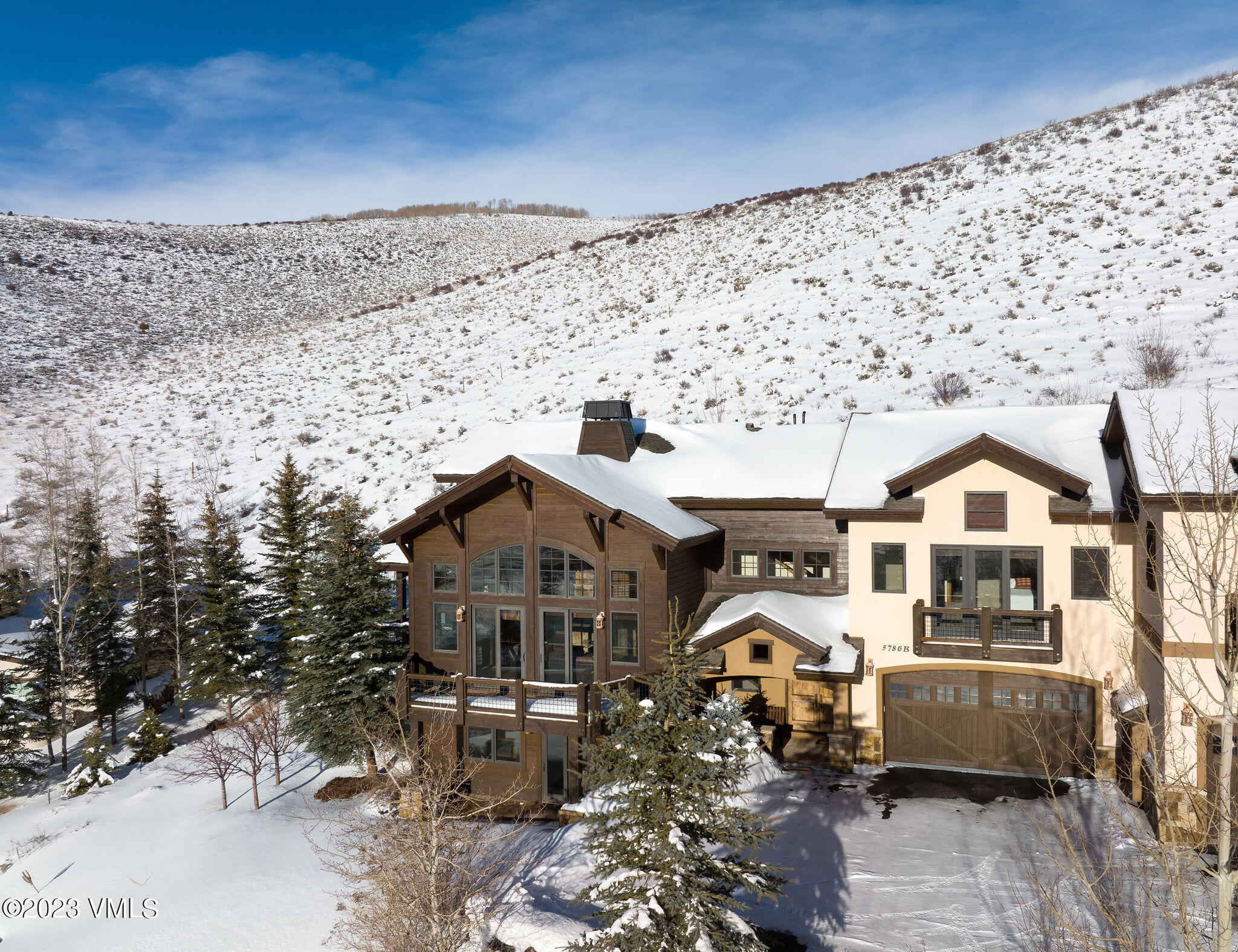 5786 Wildridge Road, Unit B Avon, CO 81620 - Photo 27 of 34 5786_e_wildridge_b_aerial_winter_b