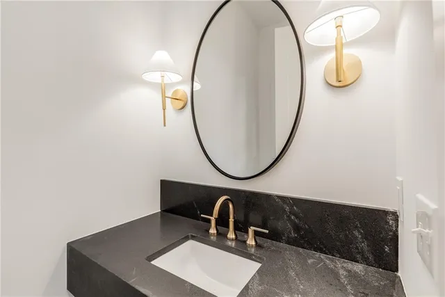 an empty room with a window and a ceiling fan