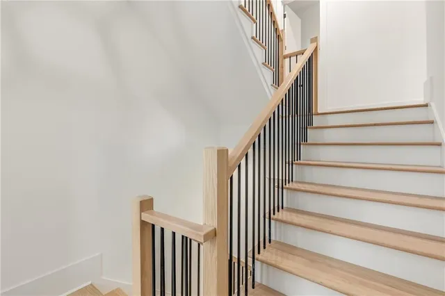 a bathroom with a shower and a sink