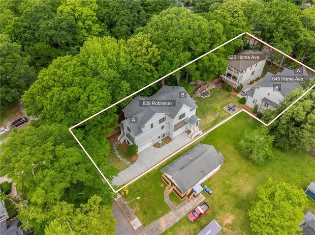 a kitchen with kitchen island a stove a sink a center island and wooden floor