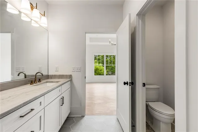 an aerial view of a house with a yard basket ball court and outdoor seating
