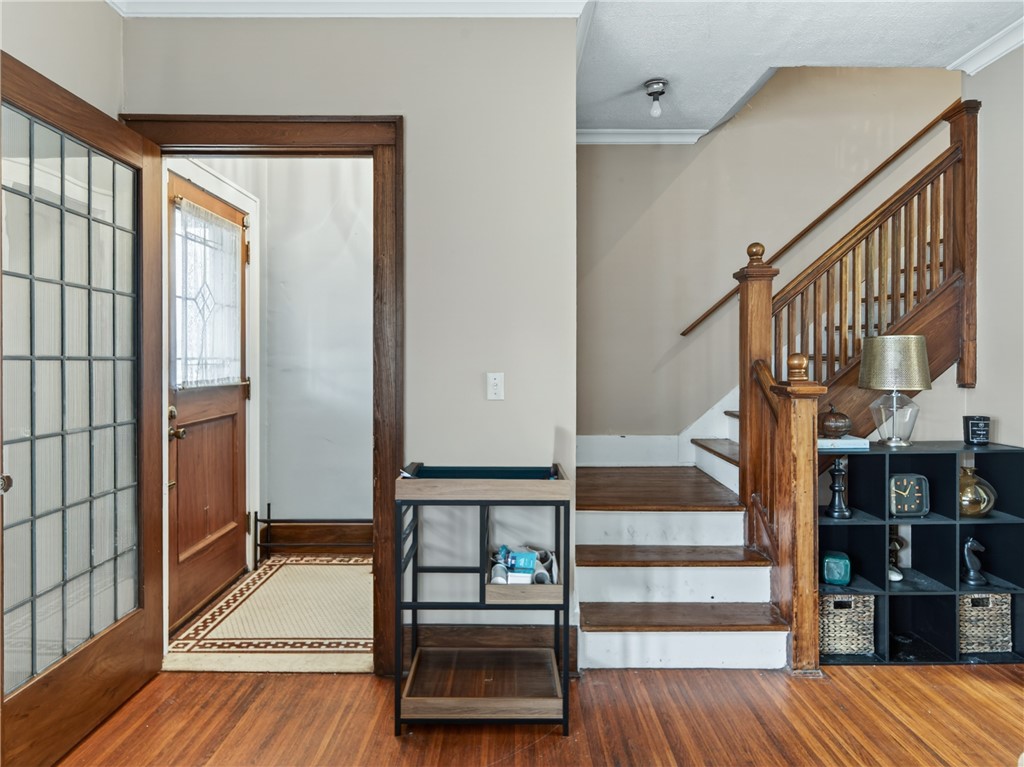 29 Harper Street Rochester, NY 14607 - Photo 5 of 46 Original tile foyer, exposed wood and hardwood flo