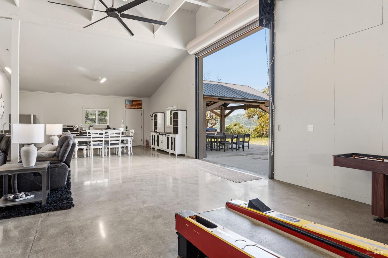 2800 Feliz Creek Road Hopland, CA 95449 - Photo 11 of 48 a room with lots of wooden furniture and a table