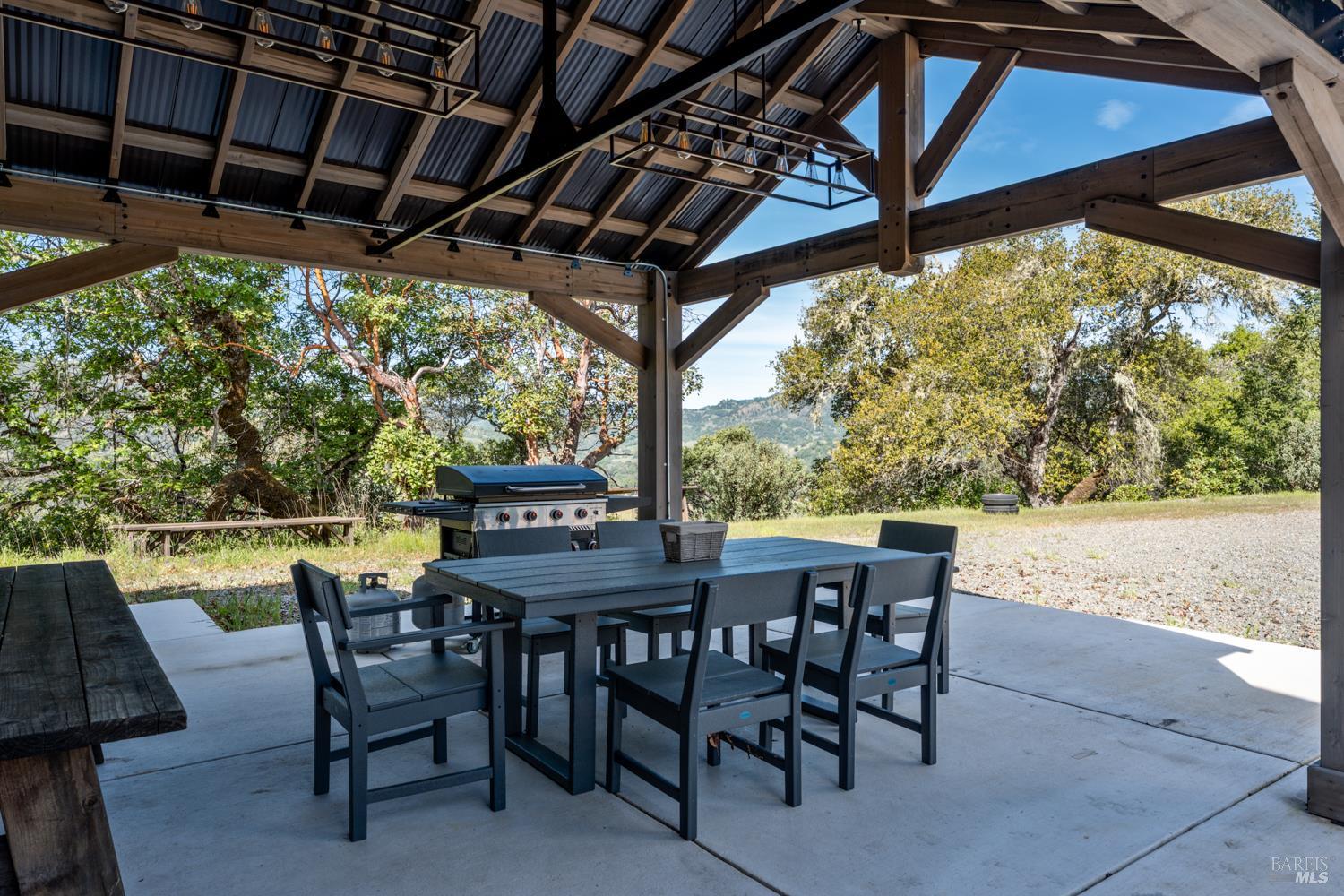 2800 Feliz Creek Road Hopland, CA 95449 - Photo 16 of 48 a view of a backyard dining space with furniture and backyard