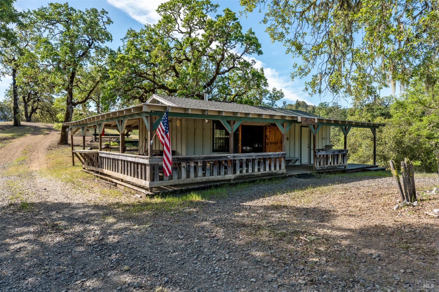 2800 Feliz Creek Road Hopland, CA 95449 - Photo 22 of 48 a view of a house with a yard and deck