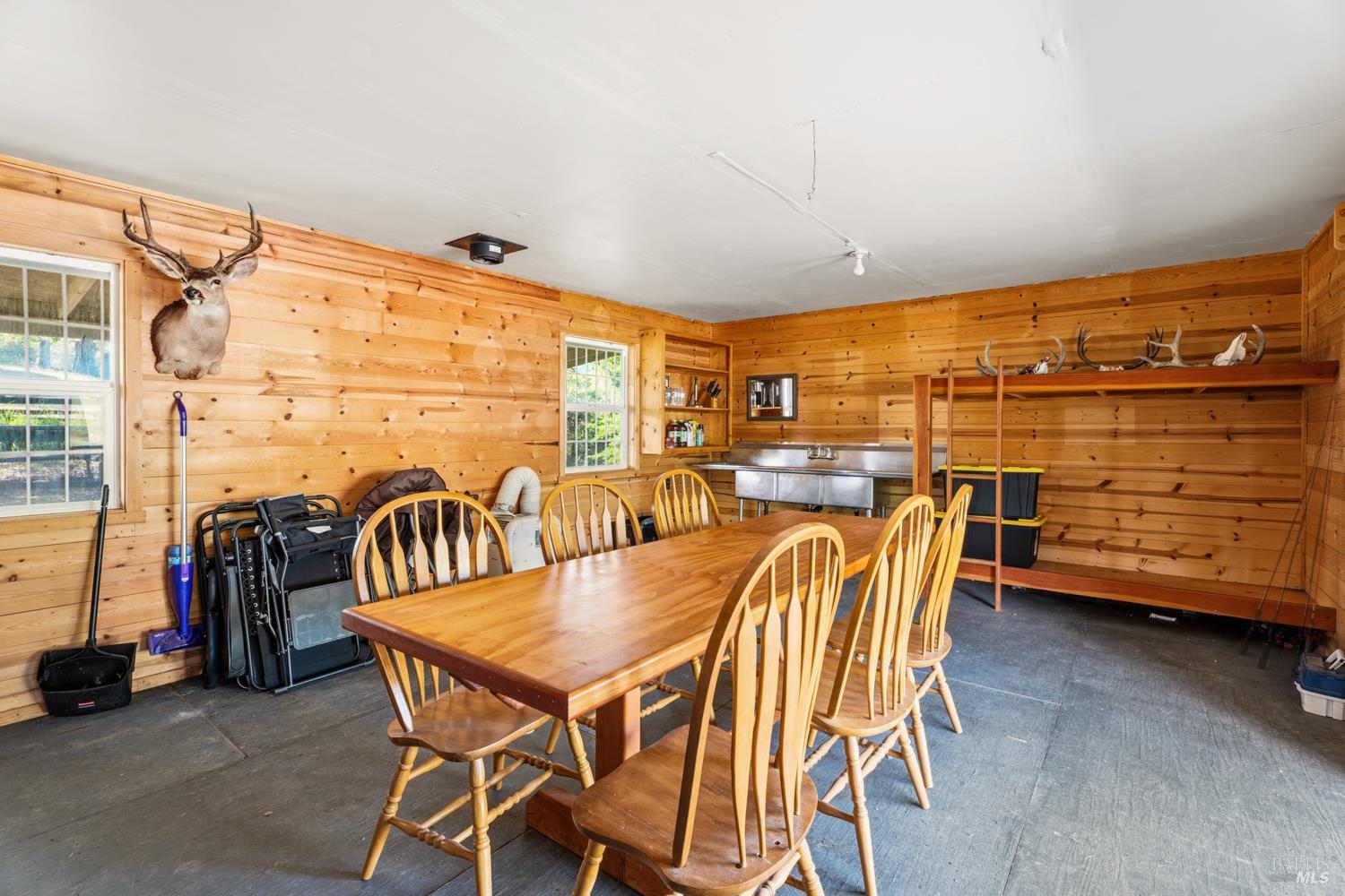 2800 Feliz Creek Road Hopland, CA 95449 - Photo 25 of 48 a dining room with furniture and a floor to ceiling window