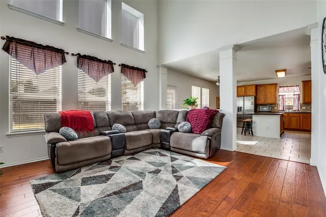 a dining room with furniture and a window