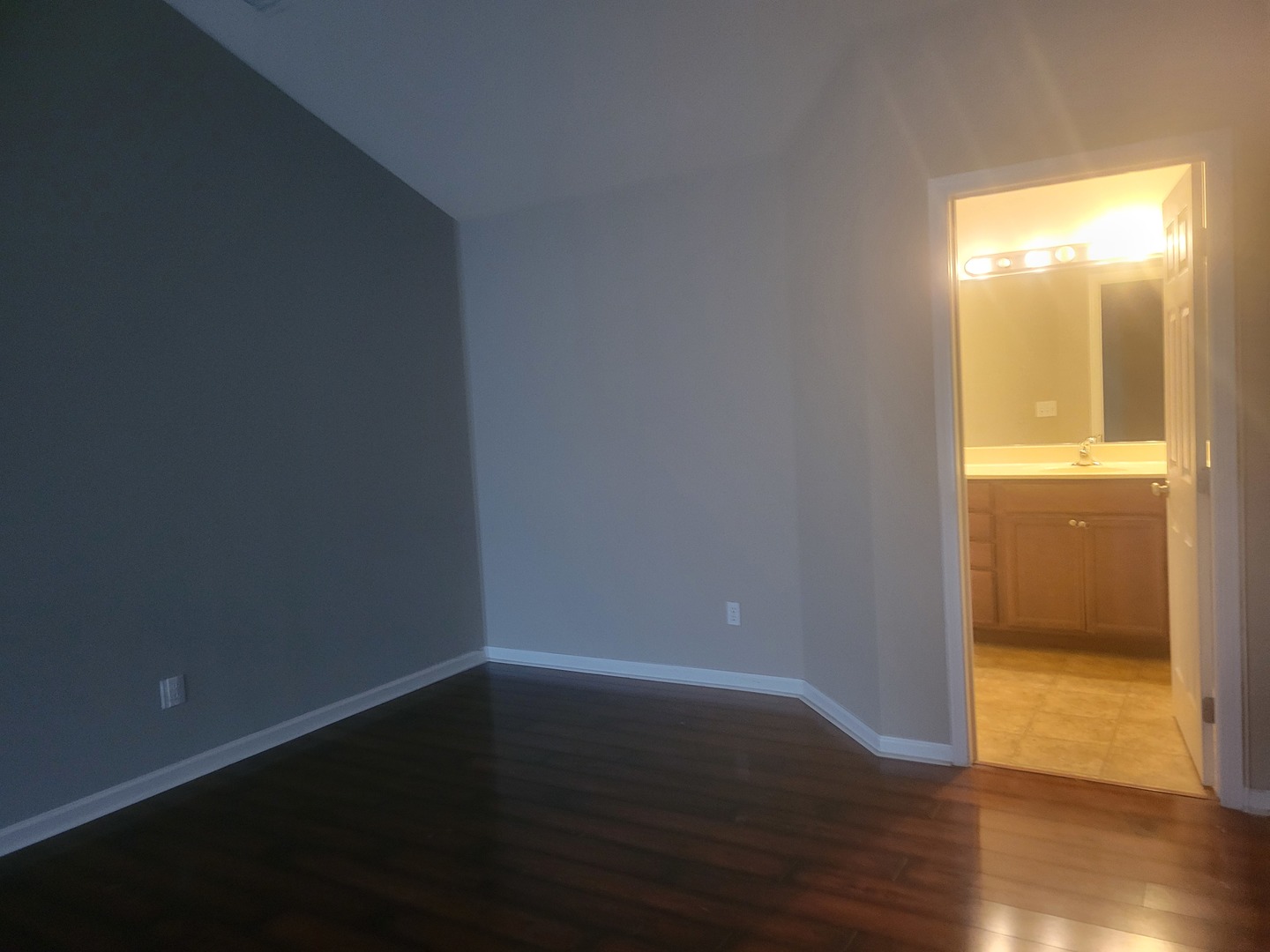 3704 Balcary Bay, Unit 3704 Champaign, IL 61822 - Photo 13 of 15 a view of an empty room with wooden floor and a window