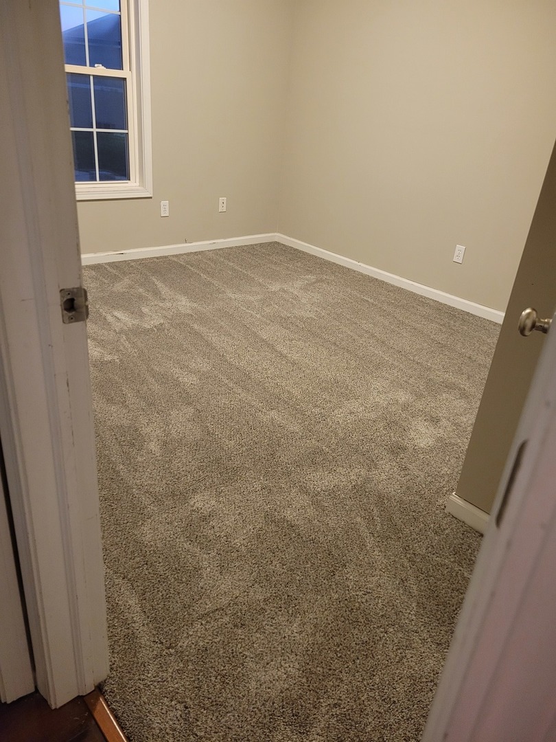 3704 Balcary Bay, Unit 3704 Champaign, IL 61822 - Photo 9 of 15 an empty room with windows