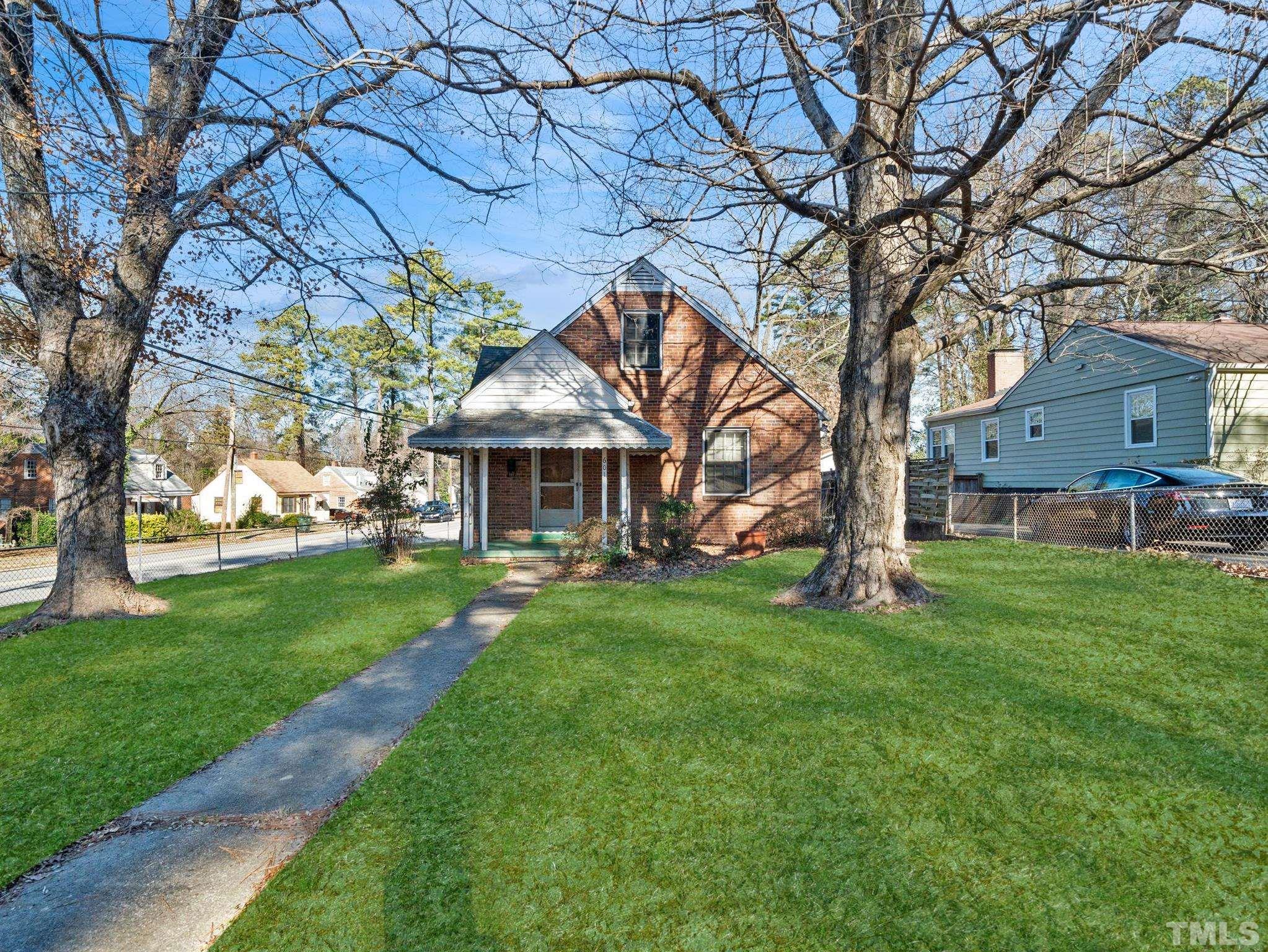 601 Edmund Street Raleigh, NC 27604 - Photo 2 of 4 a front view of a house with garden