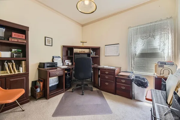 a view of a workspace with furniture