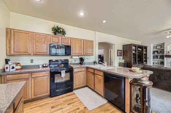 a kitchen with a sink stove and microwave