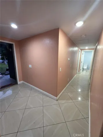 a open kitchen with cabinets and stainless steel appliances