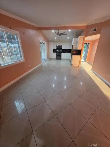 a view of an empty room with windows