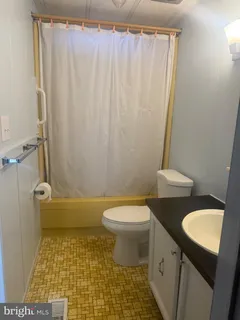 a view of a room with a door and chair