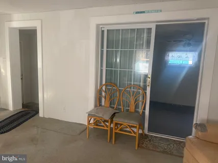 a view of an empty room with a balcony