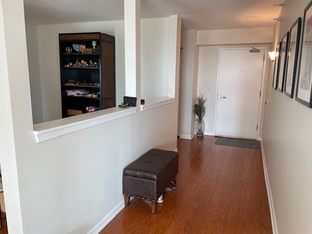 1640 Maple Avenue, Unit 1006 Evanston, IL 60201 - Photo 16 of 21 wooden floor with a bench in a room