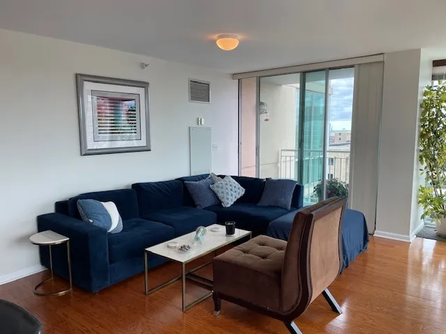 a living room with furniture and a large window