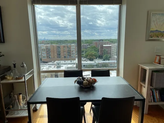 a view of a dining room with furniture and window