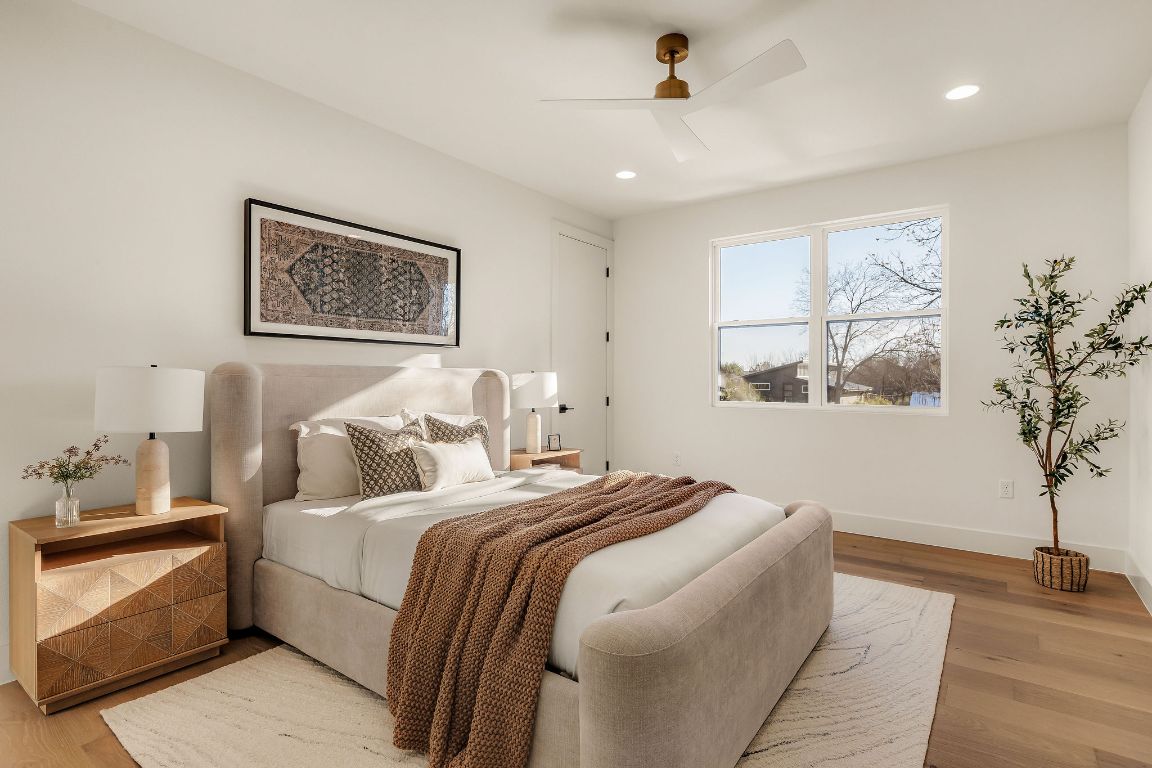 1301 Ruth Avenue Austin, TX 78757 - Photo 13 of 21 Bedroom featuring wood finished floors, ceiling fan, and recessed lighting
