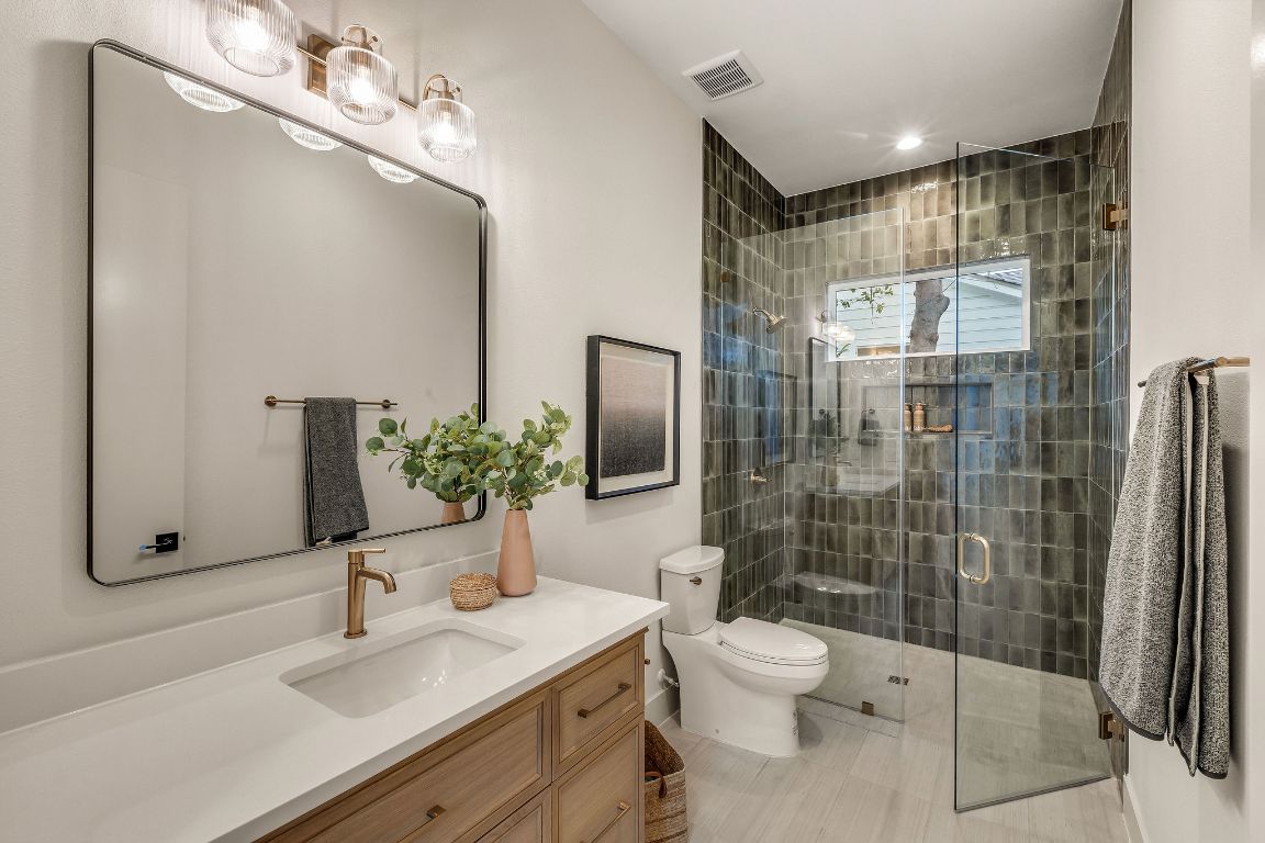 1301 Ruth Avenue Austin, TX 78757 - Photo 15 of 21 Bathroom featuring vanity, a shower stall, and recessed lighting
