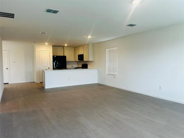 a kitchen with a sink and a stove top oven