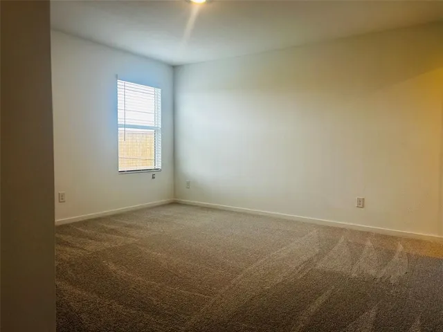 a view of cabinets and wooden floor