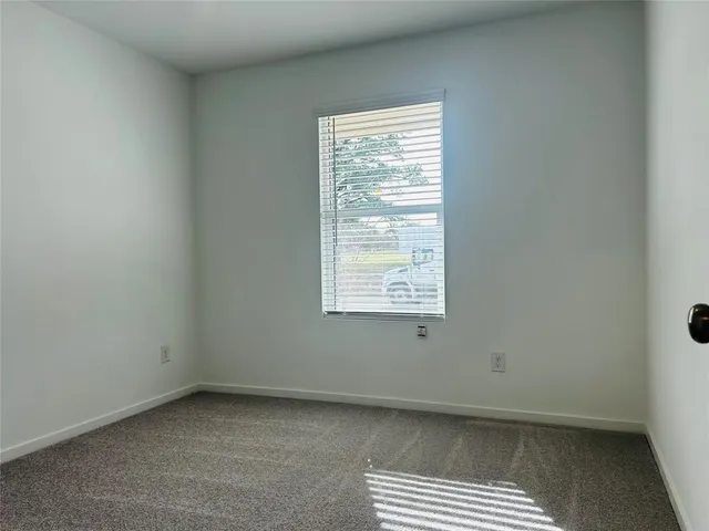 a view of a kitchen with a sink and a microwave