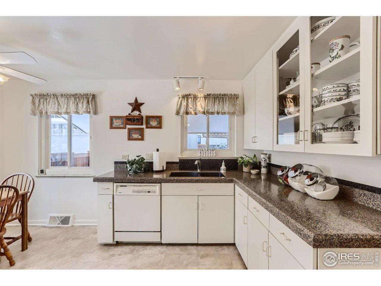 280 Echo Place Boulder, CO 80302 - Photo 11 of 40 a kitchen with granite countertop a sink and cabinets