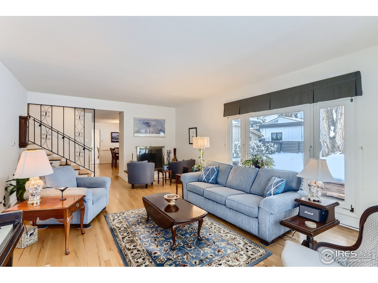 280 Echo Place Boulder, CO 80302 - Photo 14 of 40 a living room with furniture flat screen tv and a large window